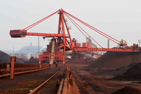 China's iron ore, steel sinks; investors shrug off stockpile reduction